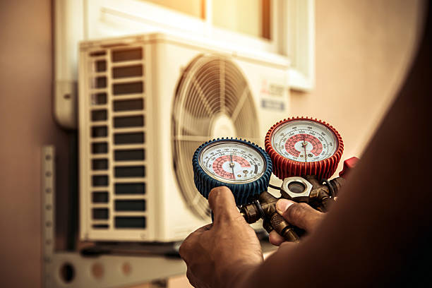 Professional Heat Pump Repair technician working in Lamar, MO